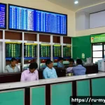 Home 17 미얀마 현지 통화 짯 환전 요령 - A busy official currency exchange bank in Yangon, Myanmar, showing a clean, well-organized interior ...